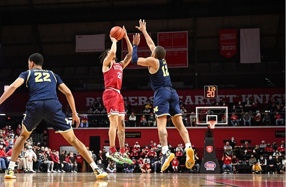 Caleb Houstan (22) and DeVante' Jones (12)