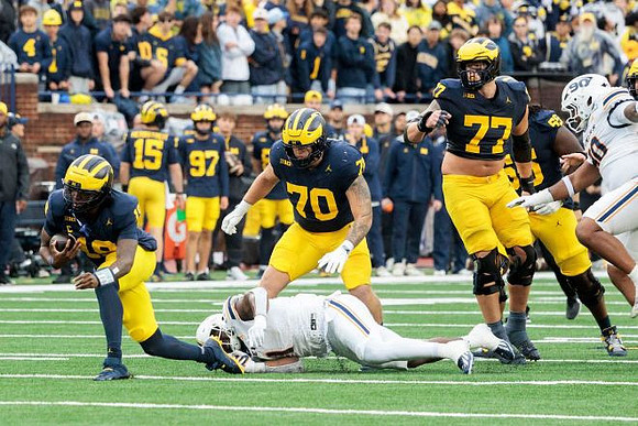 Bryce Underwood (19), Brady Norton (70), Blake Frazier (77), and Nathan Efobi (55)