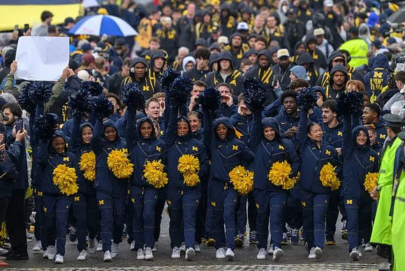 Michigan Cheerleaders and Michigan Team