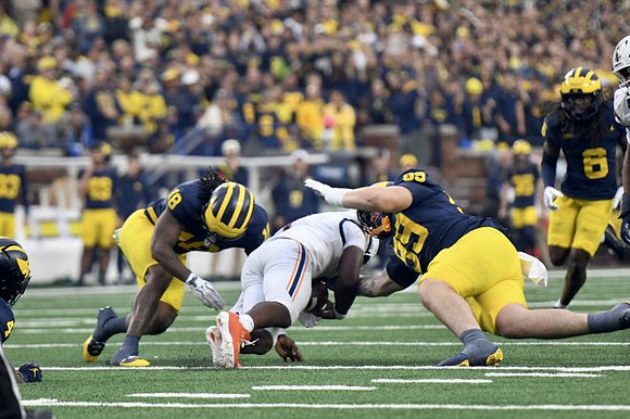 Troy Bowles (18), Bobby Kanka (99), and Jordan Young (6)