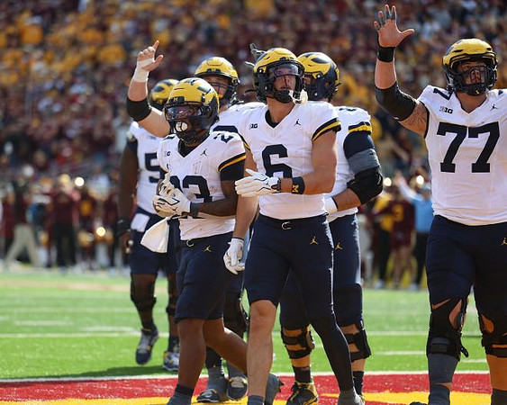 Jordan Marshall (23), JJ Buchanan (6), and Blake Frazier (77)