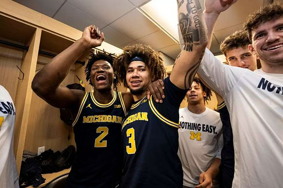 Tre Donaldson (3), L.J. Cason (2), and Michigan Team