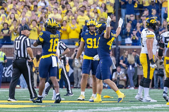Troy Bowles (18), Jonah Lea'ea (91), and Nathaniel Staehling (44)