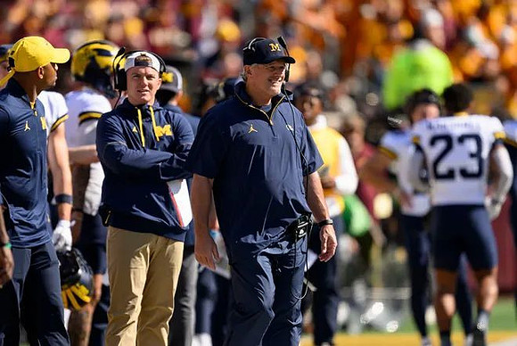 Kyle Whittingham and Michigan Team