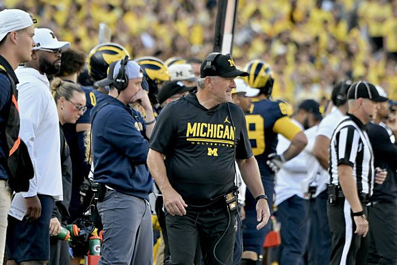 Kyle Whittingham and Michigan Team