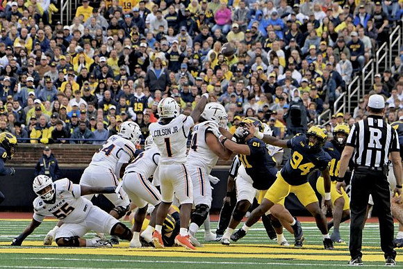 Jonah Lea'ea (91), Nate Marshall (94), and Troy Bowles (18)