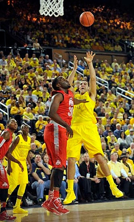 Caris LeVert (23) and Mitch McGary (4)