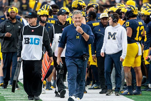 Kyle Whittingham and Michigan Team