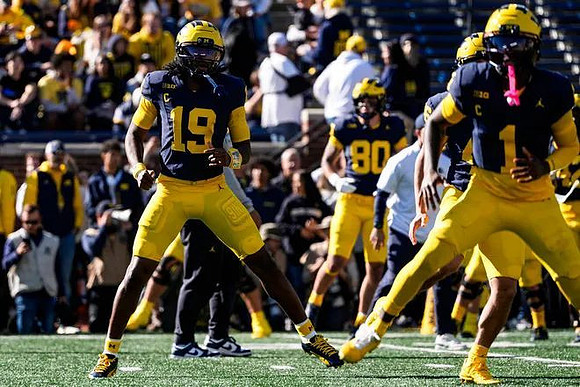 Bryce Underwood (19), Rod Moore (1), and Hogan Hansen (80)
