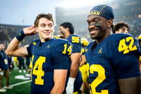 Tommy Carr (14), Jalen Hoffman (42), and Malakai Lee (58)