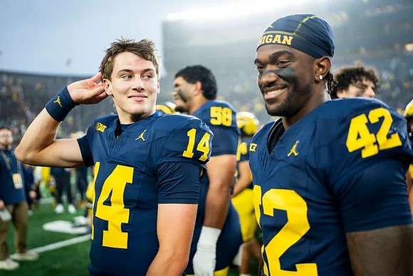 Tommy Carr (14), Jalen Hoffman (42), and Malakai Lee (58)