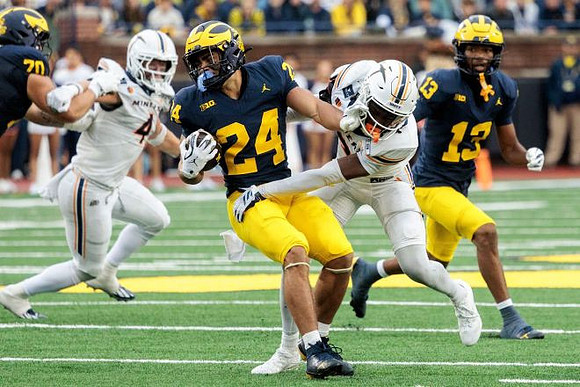 Bryson Kuzdzal (24), Brady Norton (70), and Travis Johnson (13)