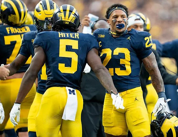 Blake Frazier (77), Savion Hiter (5), and Jordan Marshall (23)