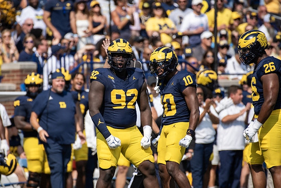 Ike Iwunnah (92), Zeke Berry (10), and Rayshaun Benny (26)
