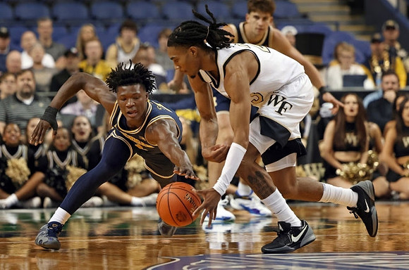 L.J. Cason (2) and Will Tschetter (42)