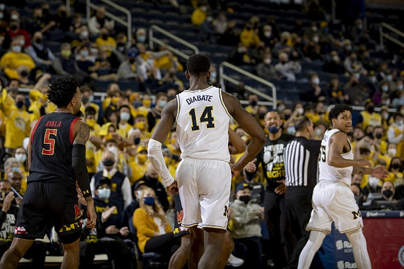 Moussa Diabate (14), Juwan Howard, and Eli Brooks (55)