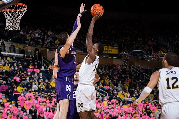 Moussa Diabate (14) and DeVante' Jones (12)