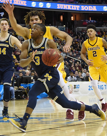 Mark Donnal (34) and Xavier Simpson (3)