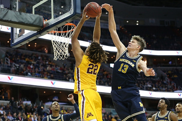 Muhammad-Ali Abdur-Rahkman (12), Moritz Wagner (13), Derrick Walton Jr. (10), and Zak Irvin (21)