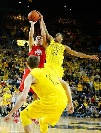 Nik Stauskas (11) and Trey Burke (3)