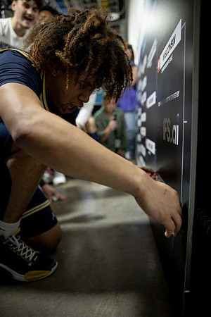 Tre Donaldson (3) and Michigan Team