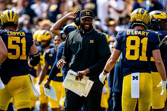 Greg Crippen (51), Sherrone Moore, and Peyton O'Leary (81)