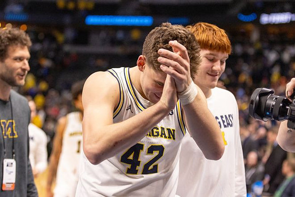 Will Tschetter (42) and Michigan Team