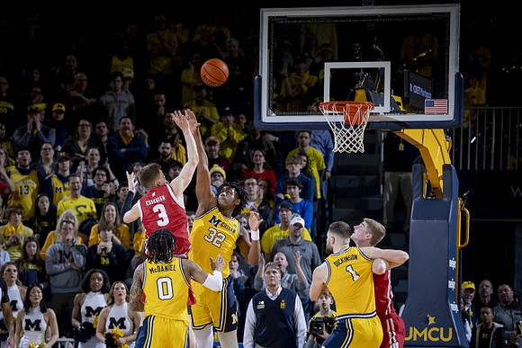 Dug McDaniel (0), Tarris Reed Jr. (32), and Hunter Dickinson (1)