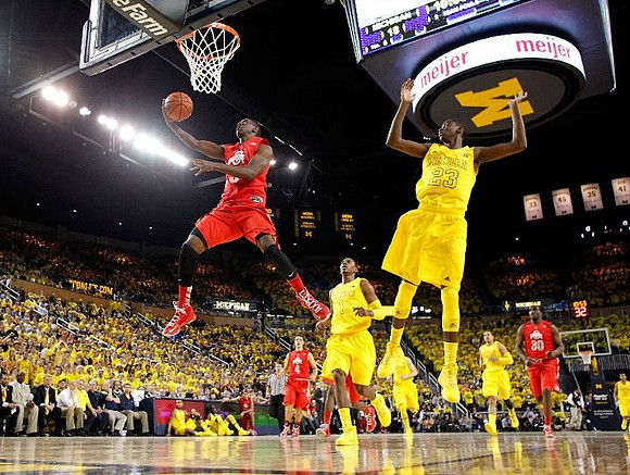 Glenn Robinson III (1), Caris LeVert (23), and Jordan Morgan (52)