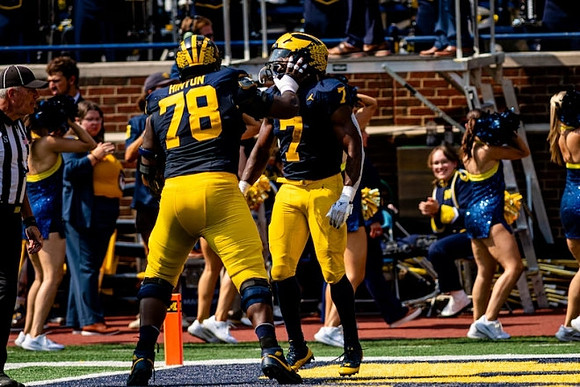 Myles Hinton (78) and Donovan Edwards (7)