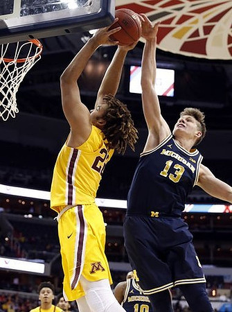 Moritz Wagner (13) and Derrick Walton Jr. (10)
