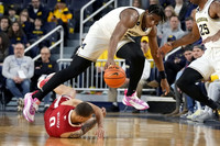 Tarris Reed Jr. (32), Jace Howard (25), and Dug McDaniel (0)