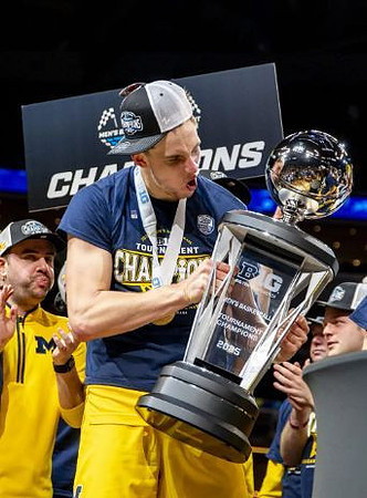 Will Tschetter (42) and Big Ten Tournament Championship Trophy