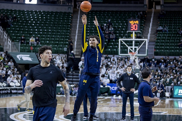 Brandon Johns Jr. (23) and Adrien Nunez (0)