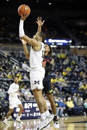 Kobe Bufkin (2) and DeVante' Jones (12)