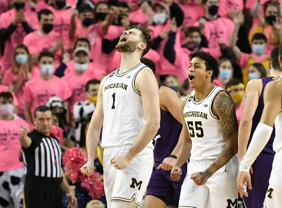 Hunter Dickinson (1) and Eli Brooks (55)