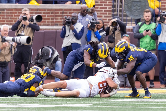 Jyaire Hill (20), Jaishawn Barham (1), and Ernest Hausmann (15)
