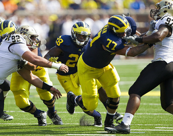 Fitzgerald Toussaint (28) and Taylor Lewan (77)