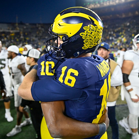 Alex Orji (10) and Davis Warren (16)