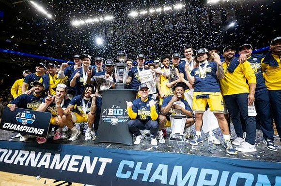 Dusty May, Michigan Team, and Big Ten Tournament Championship Trophy