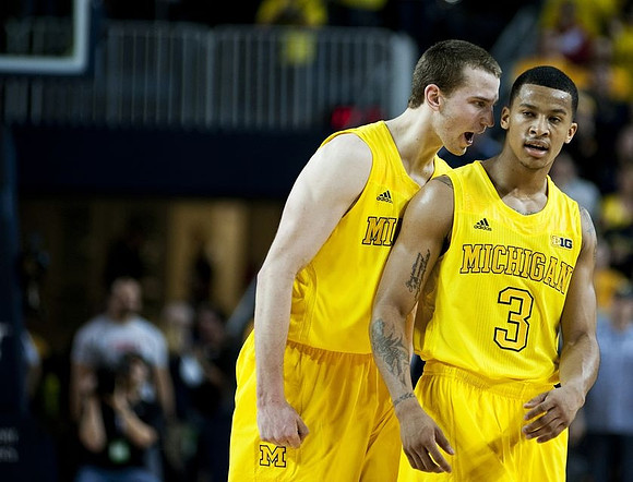 Nik Stauskas (11) and Trey Burke (3)