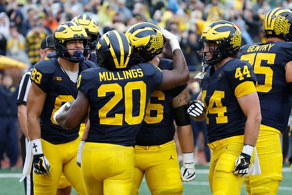 Zack Marshall (83), Kalel Mullings (20), Dominick Giudice (56), Max Bredeson (44), and Andrew Gentry (75)