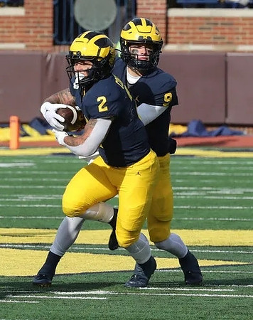 Blake Corum (2) and J.J. McCarthy (9)