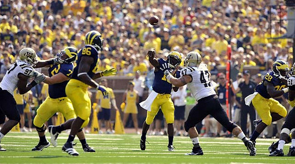 Mark Huyge (72), Kevin Koger (86), Denard Robinson (16), and Fitzgerald Toussaint (28)