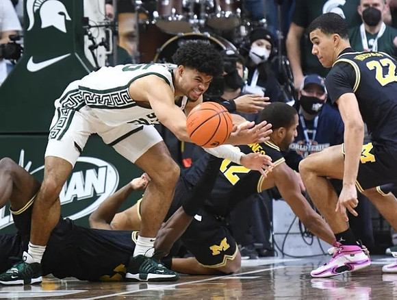 DeVante' Jones (12) and Caleb Houstan (22)