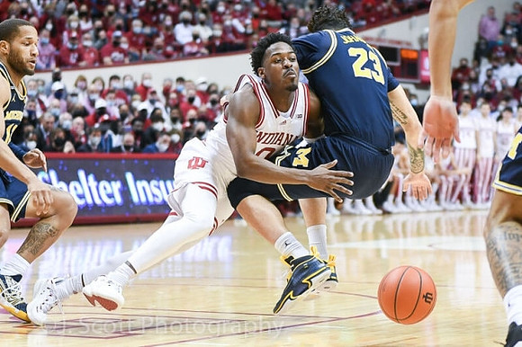 DeVante' Jones (12) and Brandon Johns Jr. (23)