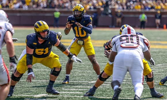 Greg Crippen (51) and Alex Orji (10)