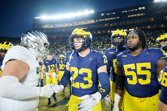 Cole Sullivan (23) and Nathan Efobi (55)