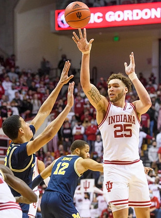 Caleb Houstan (22) and DeVante' Jones (12)