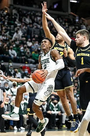 DeVante' Jones (12) and Hunter Dickinson (1)